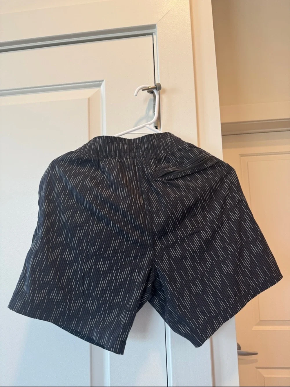 RHONE Black Swim Trunks with Subtle Dash Pattern